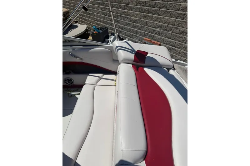 Slide: The Image of 2013 Crownline 21 SS boat interior with white and red seating. - 10