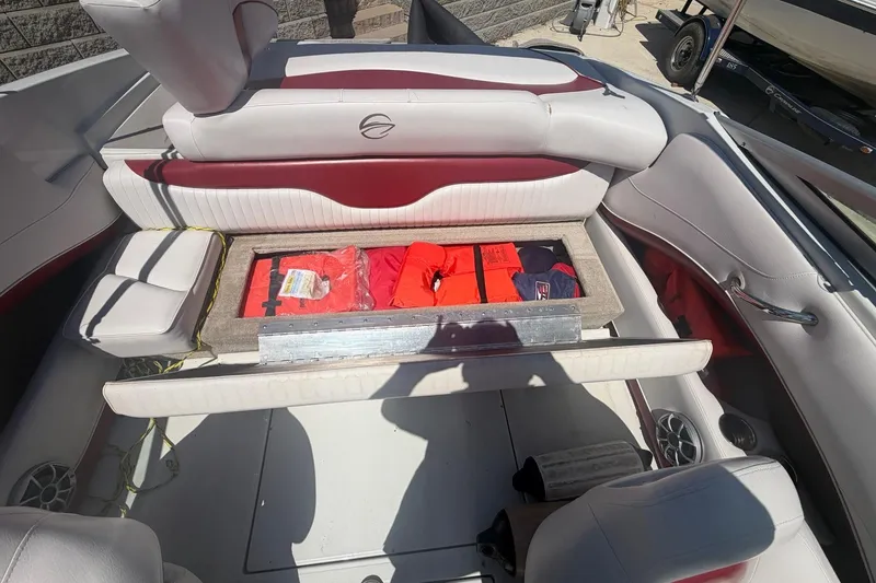 Slide: The Image of Interior of a 2013 Crownline 21 SS boat with storage compartment open. - 5