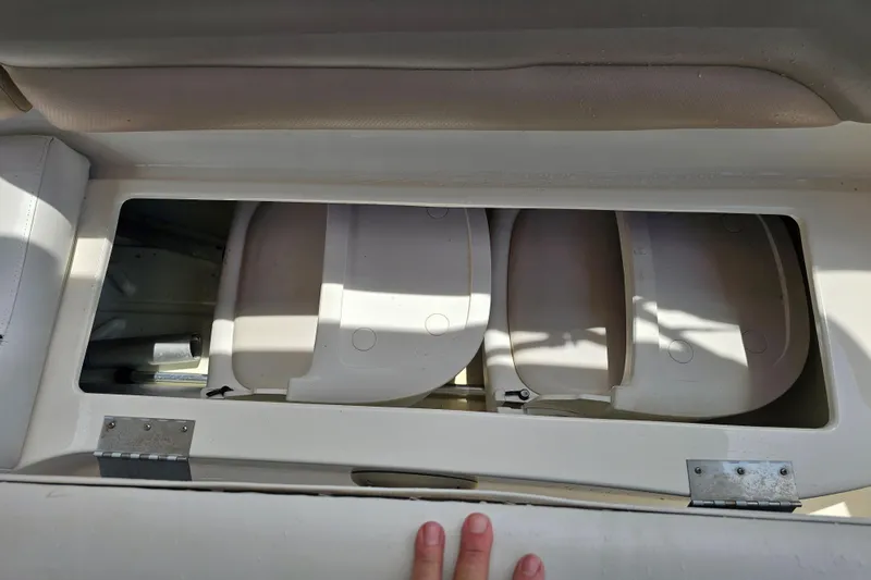 Slide: The Image of Open storage compartment on a 2006 Hurricane SunDeck 237 DC OB boat. - 25