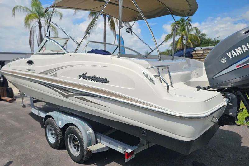 Slide: The Image of 2006 Hurricane SunDeck 237 DC OB boat on trailer with Yamaha outboard motor. - 5