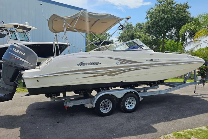 Slide: The Image of 2006 Hurricane SunDeck 237 DC OB boat on trailer with Yamaha outboard motor. - 4