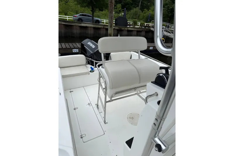 Slide: The Image of 2001 Boston Whaler 21 Outrage boat interior with seating and controls. - 12