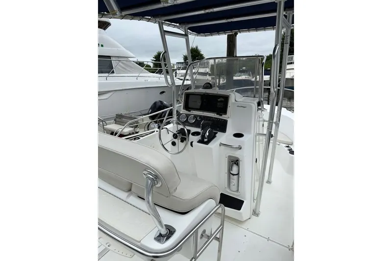 Slide: The Image of 2001 Boston Whaler 21 Outrage boat interior with steering console and seating. - 9