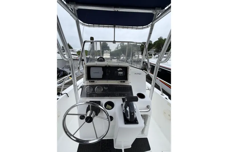 Slide: The Image of 2001 Boston Whaler 21 Outrage boat console with steering wheel and Garmin navigation system. - 8