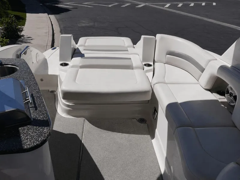 Slide: The Image of The image shows the cockpit of a 2008 Chaparral 264 Sunesta with white cushioned seating. - 20
