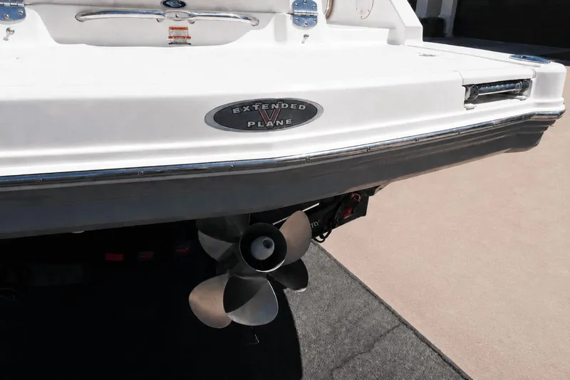 Slide: The Image of The image shows the stern of a 2008 Chaparral 264 Sunesta boat with a propeller. - 31