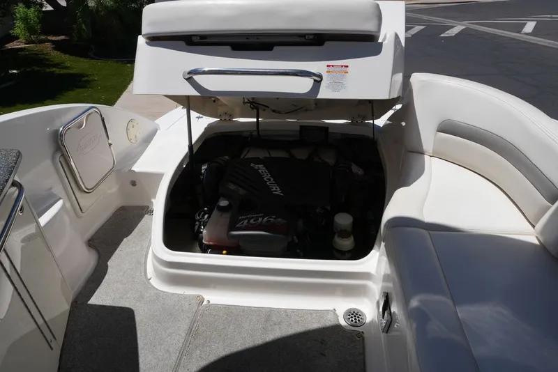 Slide: The Image of The 2008 Chaparral 264 Sunesta features an open engine compartment with a Mercury 496 engine. - 21