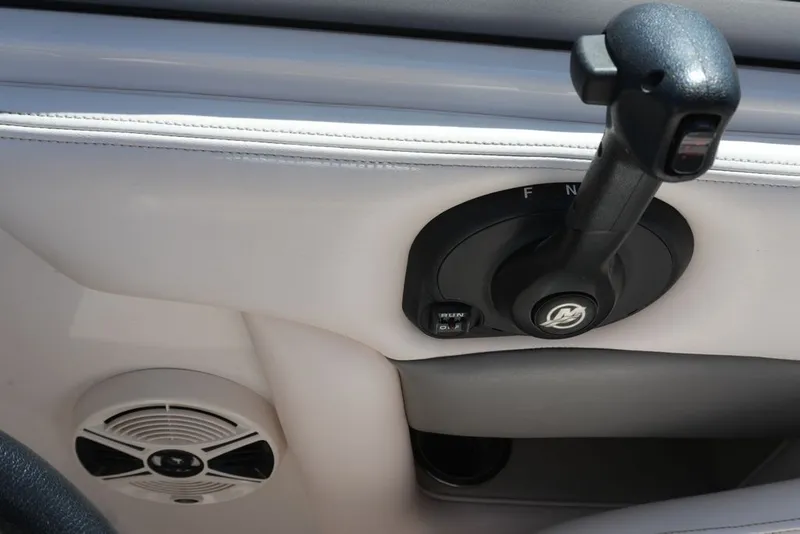 Slide: The Image of Close-up of a throttle lever and speaker in a boat. - 10