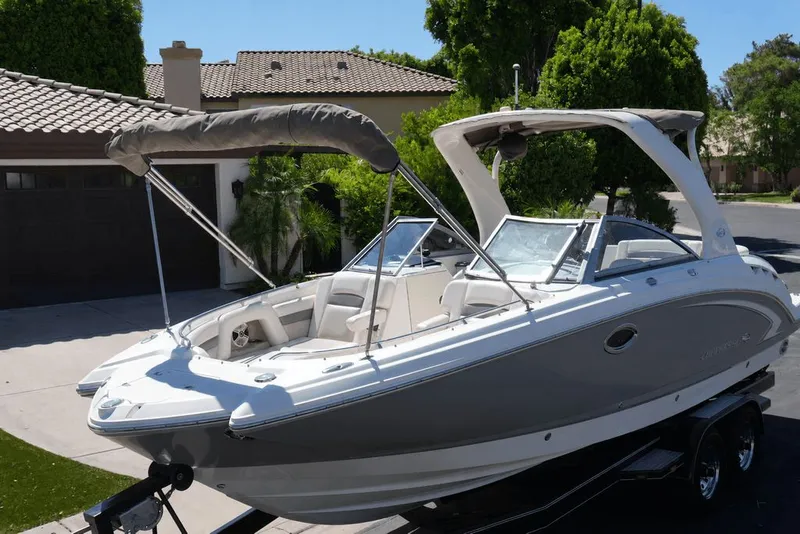 Slide: The Image of A 2008 Chaparral 264 Sunesta boat on a trailer in a residential area. - 3