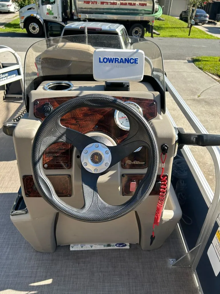 Slide: The Image of The image shows the helm of a 2023 Sun Tracker Bass Buggy with a Lowrance device. - 4