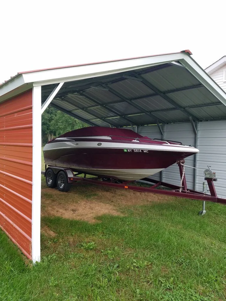 The Image of 2005 Crownline 192 BR parked in a carport. - 0