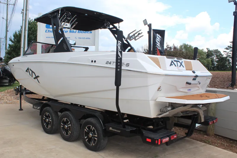 Slide: The Image of 2021 ATX Surf Boats 24 Type-S on trailer, displayed outdoors. - 5