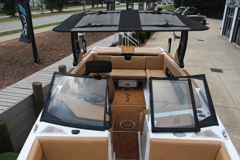 Slide: The Image of 2021 ATX Surf Boats 24 Type-S interior with tan seating and sleek design. - 13