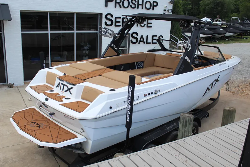 Slide: The Image of 2021 ATX Surf Boats 24 Type-S displayed at a dealership, showcasing sleek design and luxury features. - 3
