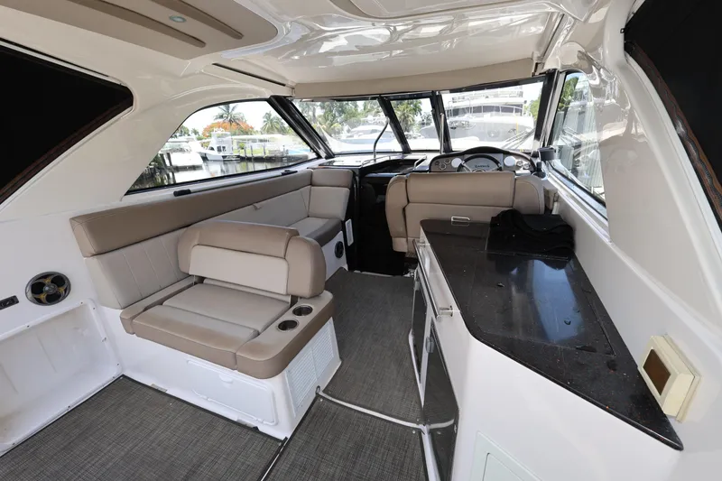 Slide: The Image of Luxurious interior of a 2015 Regal 35 Sport Coupe yacht with plush seating and sleek design. - 6