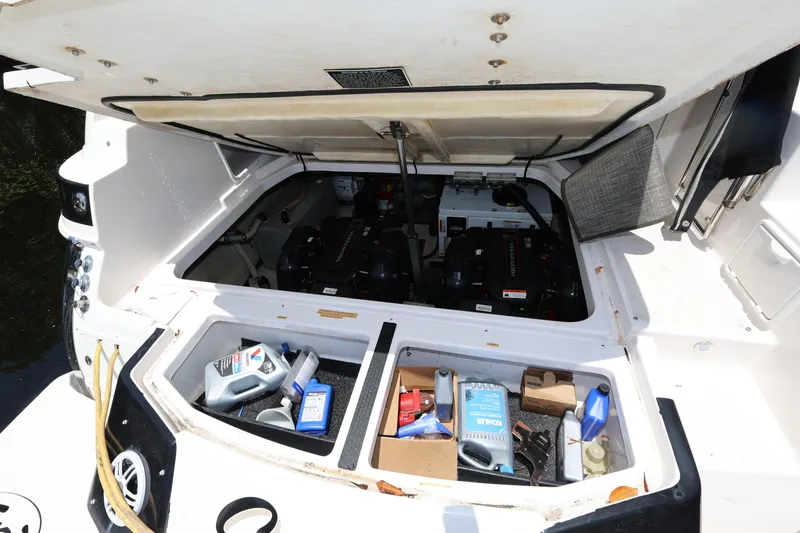 Slide: The Image of Engine compartment of a 2015 Regal 35 Sport Coupe with maintenance supplies visible. - 24