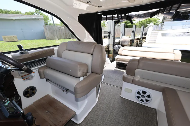 Slide: The Image of Interior of 2015 Regal 35 Sport Coupe, featuring luxurious seating and modern design. - 14