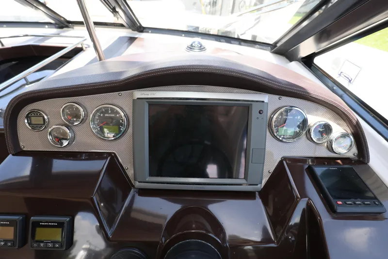 Slide: The Image of Dashboard of a 2015 Regal 35 Sport Coupe with gauges and navigation screen. - 11