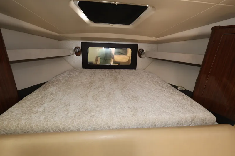 Slide: The Image of Interior cabin of 2015 Regal 35 Sport Coupe with cozy bed and window. - 19