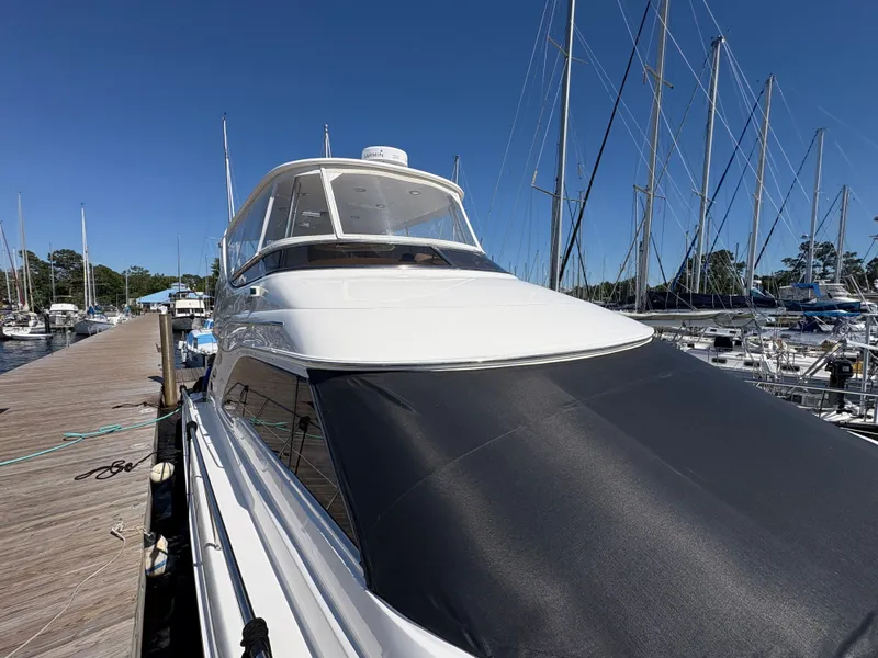 Slide: The Image of Sea Ray 560 Sedan Bridge 2000 at dock with clear blue sky. - 5