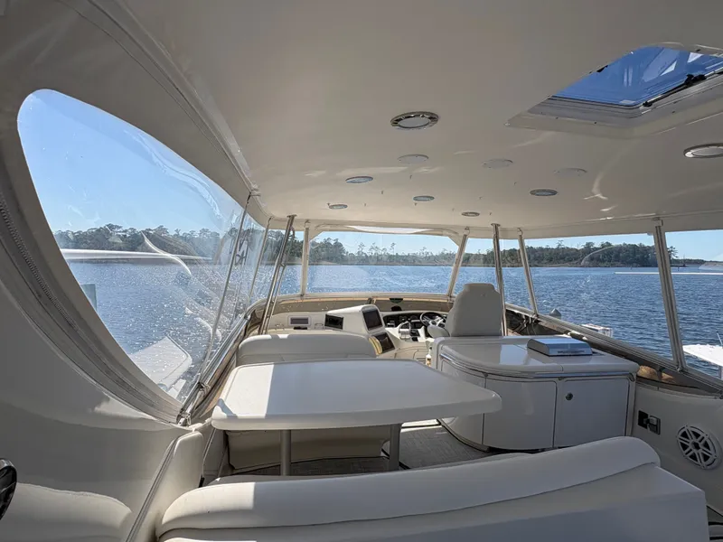 Slide: The Image of Interior of a 2000 Sea Ray 560 Sedan Bridge with panoramic windows and comfortable seating. - 12