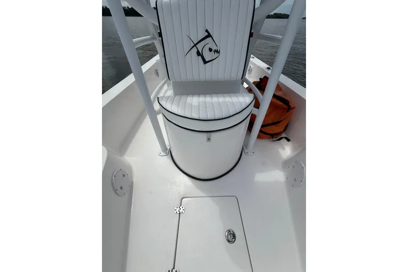 Slide: The Image of 2024 Piranha Boatworks Casador B2250 interior with white seating and storage compartment. - 34