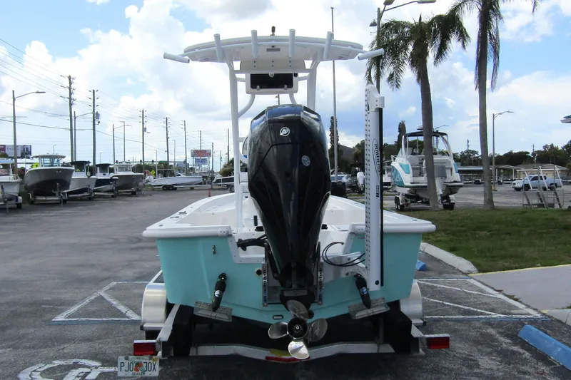 Slide: The Image of 2024 Piranha Boatworks Casador B2250 in parking lot, rear view with outboard motor. - 4
