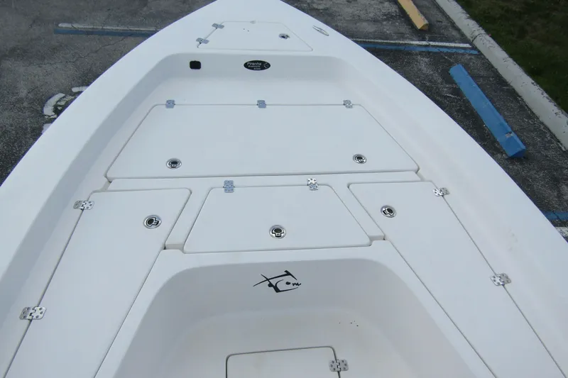 Slide: The Image of 2024 Piranha Boatworks Casador B2250 deck with storage compartments, showcasing sleek design. - 8