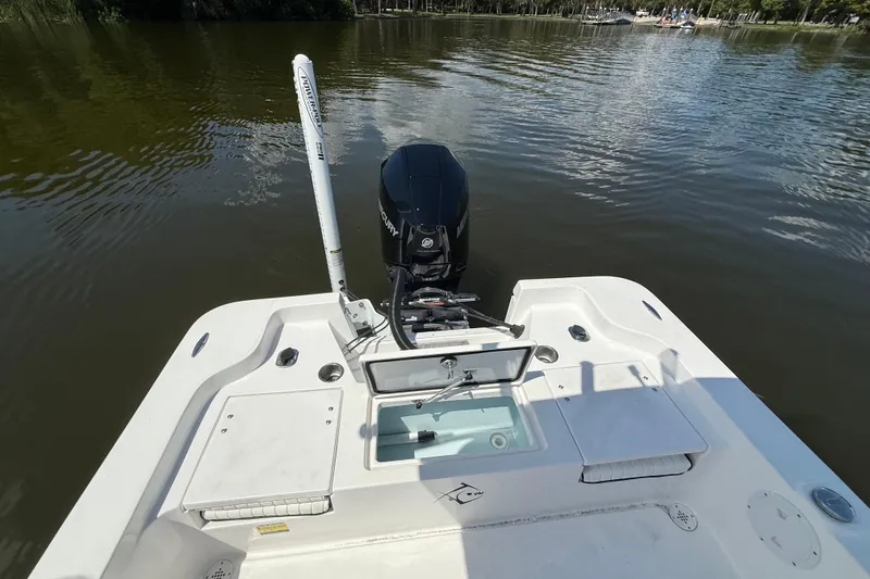 Slide: The Image of 2024 Piranha Boatworks Casador B2250 with Mercury outboard motor on calm water. - 33