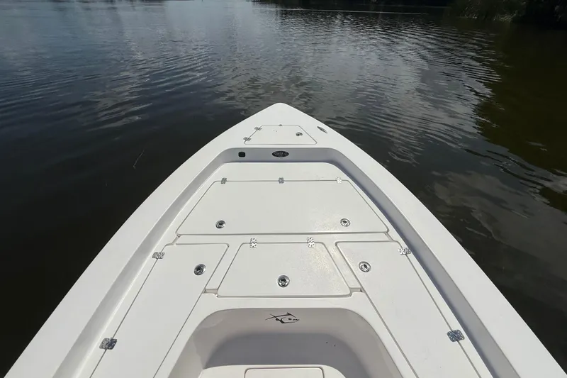 Slide: The Image of 2024 Piranha Boatworks Casador B2250 bow view on calm water. - 30