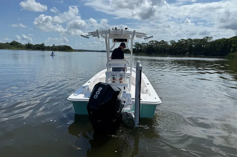 Slide: The Image of 2024 Piranha Boatworks Casador B2250 on calm lake under cloudy sky. - 24
