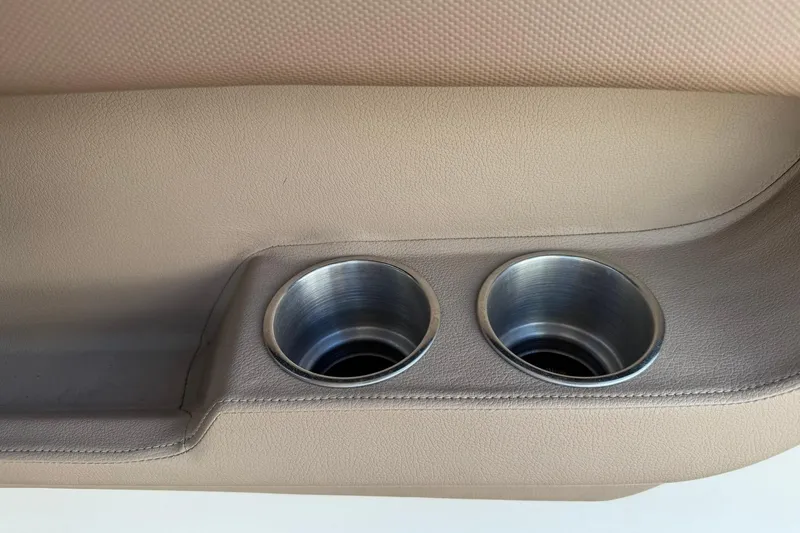 Slide: The Image of Beige interior with dual cup holders in a 2007 Cobalt 212 boat. - 51
