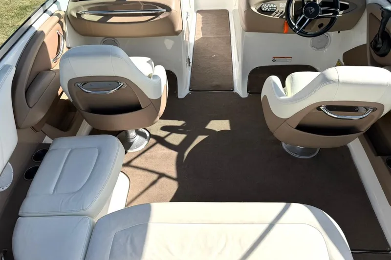 Slide: The Image of Interior of a 2007 Cobalt 212 boat with beige and white seating. - 25