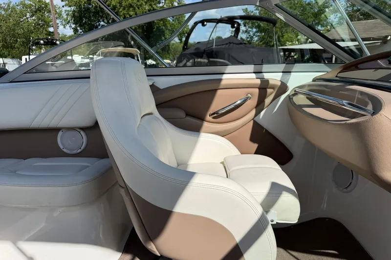 Slide: The Image of Interior of a 2007 Cobalt 212 boat with beige and white seating. - 30