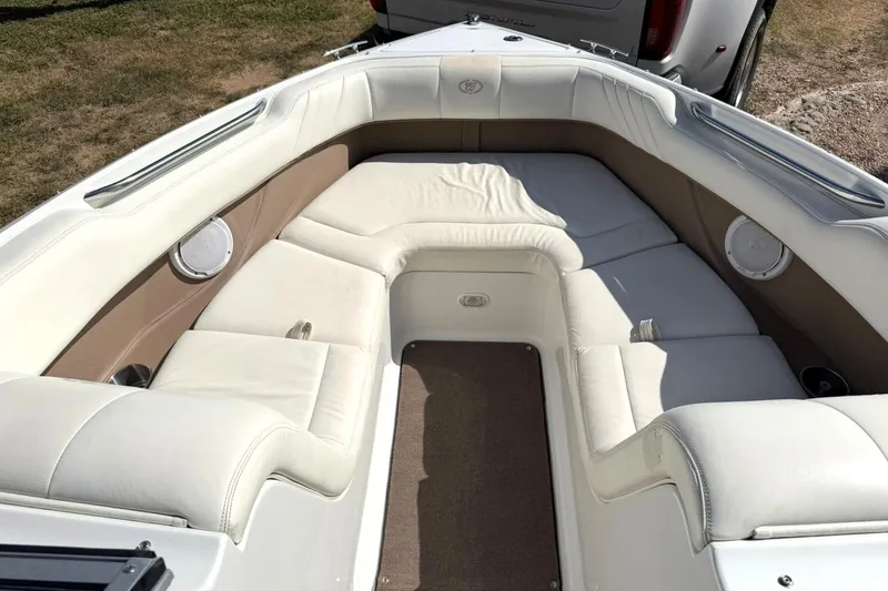 Slide: The Image of Interior of a 2007 Cobalt 212 boat with white leather seating and speakers. - 5