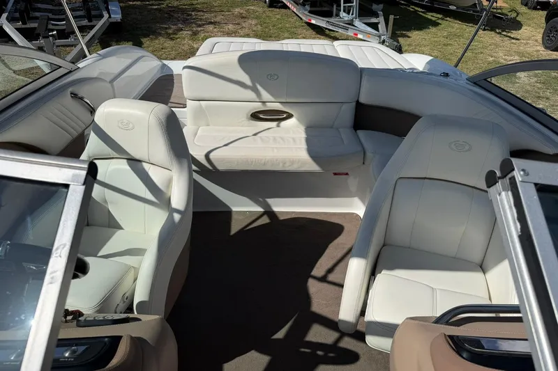 Slide: The Image of Interior of a 2007 Cobalt 212 boat with white leather seating. - 48