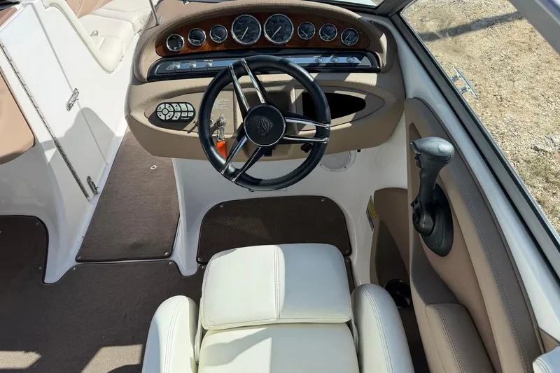 Slide: The Image of 2007 Cobalt 212 boat interior with steering wheel and dashboard controls. - 34