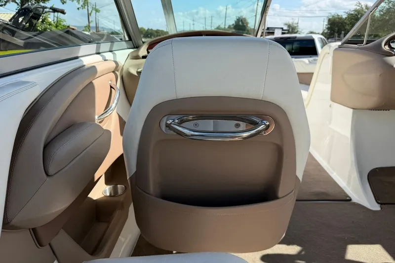 Slide: The Image of Interior of a 2007 Cobalt 212 boat, featuring beige and white seating. - 28