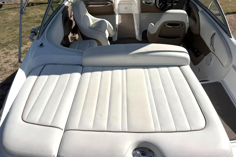 Slide: The Image of Interior of a 2007 Cobalt 212 boat with white leather seating. - 23