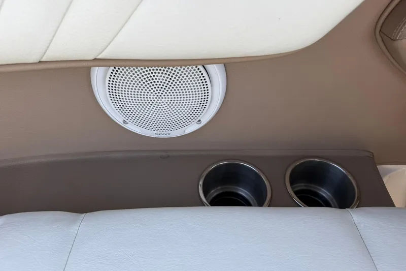 Slide: The Image of Interior of 2007 Cobalt 212 featuring speaker and dual cup holders. - 49