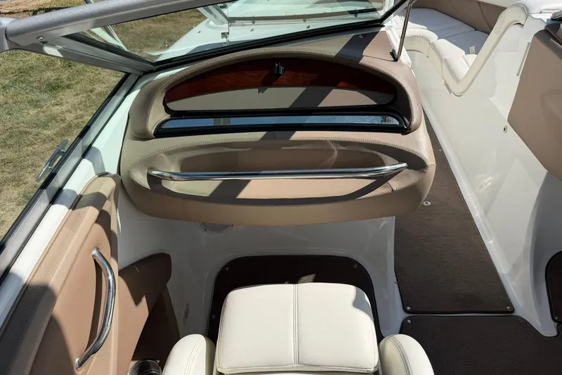 Slide: The Image of Interior of a 2007 Cobalt 212 boat, featuring beige seating and sleek design. - 31