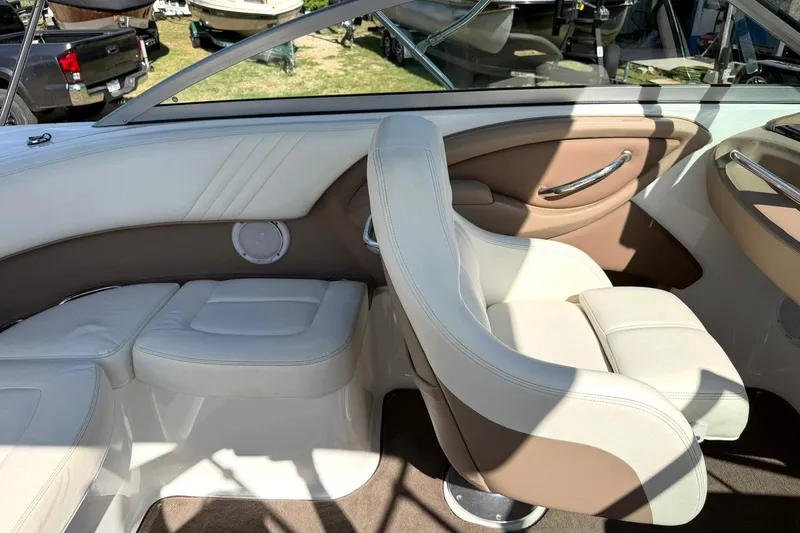 Slide: The Image of Interior of a 2007 Cobalt 212 boat with beige and white seating. - 29