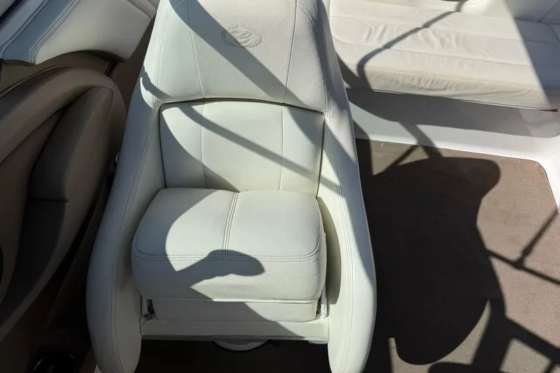 Slide: The Image of White leather seat in a 2007 Cobalt 212 boat, with sunlight and shadows. - 33