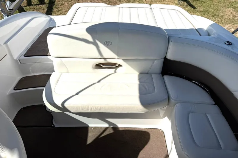 Slide: The Image of 2007 Cobalt 212 boat interior with white leather seating and elegant design. - 26