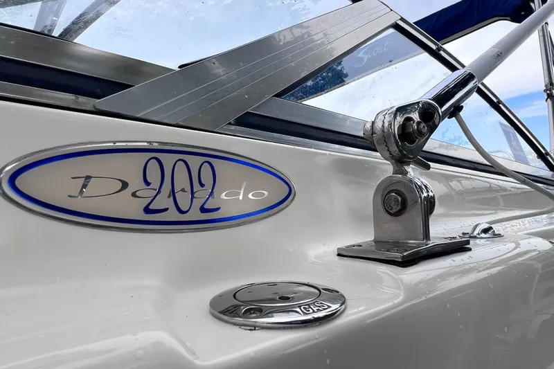 Slide: The Image of Close-up of a 2001 Scout 202 Dorado boat with visible gas cap. - 6