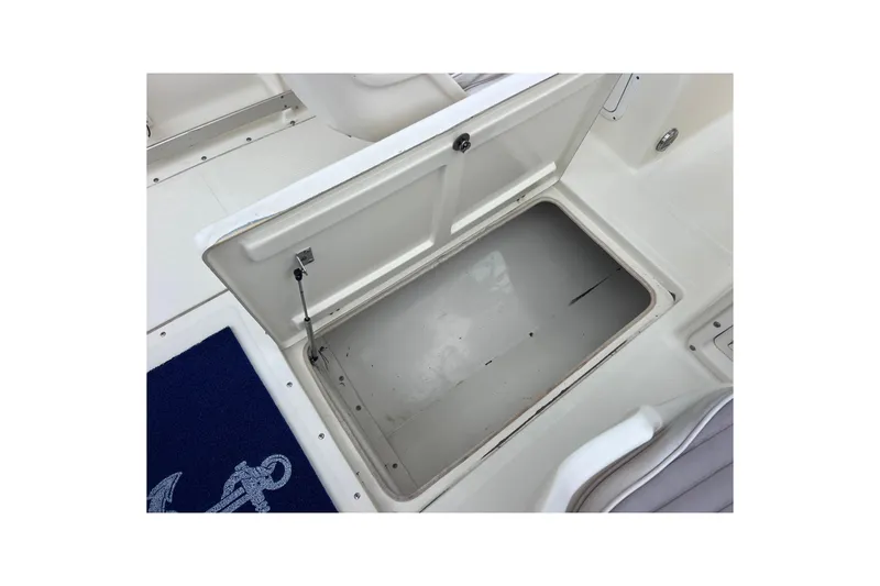 Slide: The Image of Open storage compartment on a 2001 Scout 202 Dorado boat deck. - 39