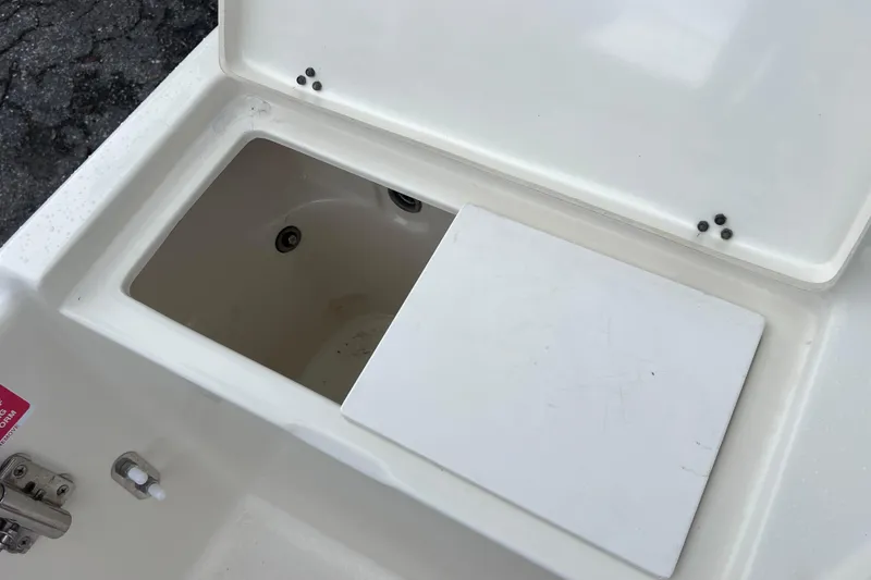 Slide: The Image of Open storage compartment on a 2001 Scout 202 Dorado boat. - 21