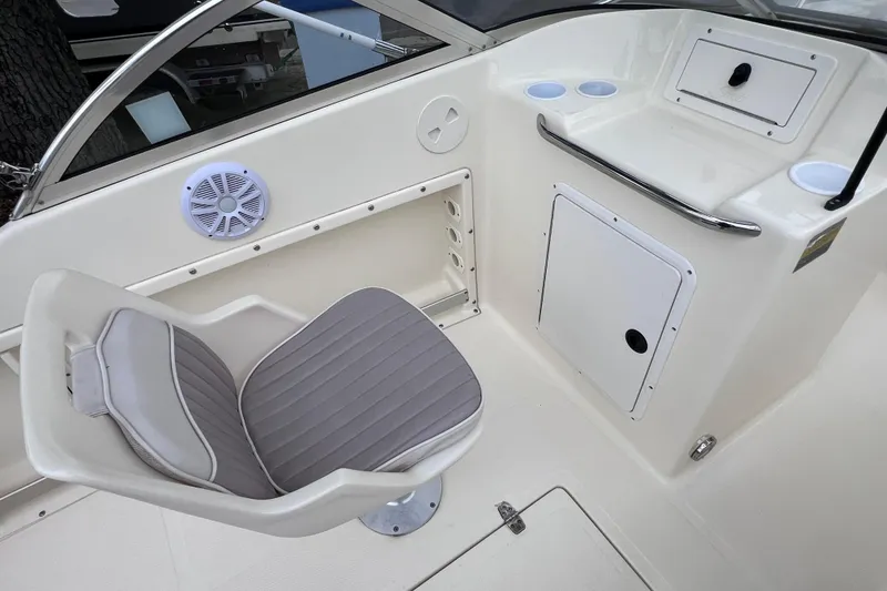 Slide: The Image of 2001 Scout 202 Dorado boat interior with seating and storage compartments. - 25
