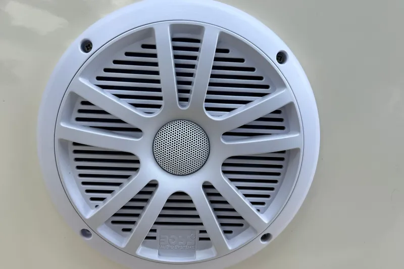 Slide: The Image of Close-up of a white speaker on a 2001 Scout 202 Dorado boat. - 32
