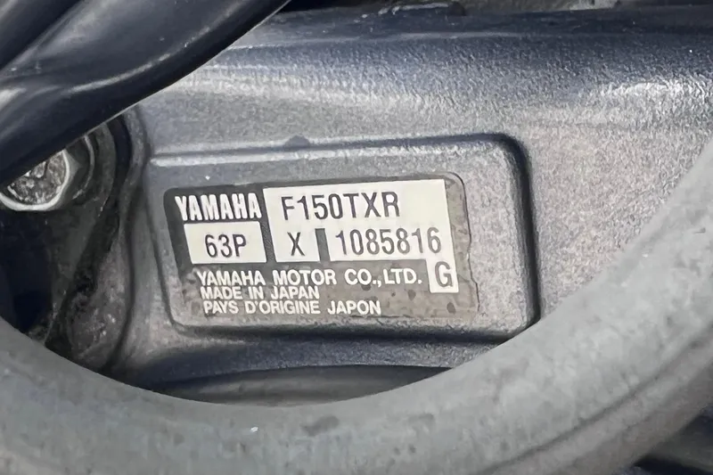 Slide: The Image of Yamaha F150TXR engine label on a 2001 Scout 202 Dorado boat. - 12